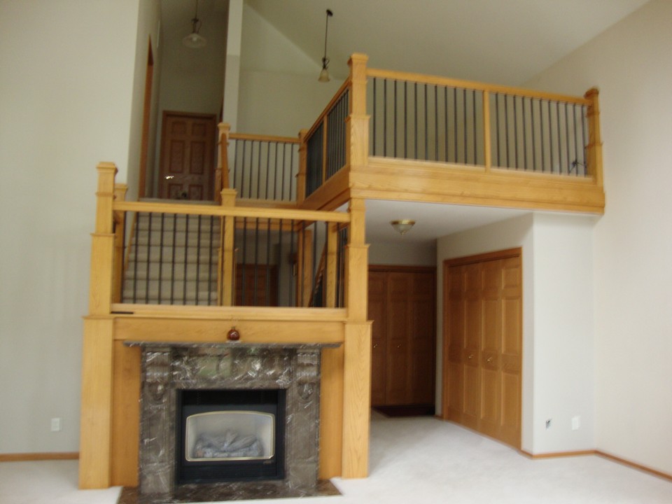 open stairway and gas fireplace