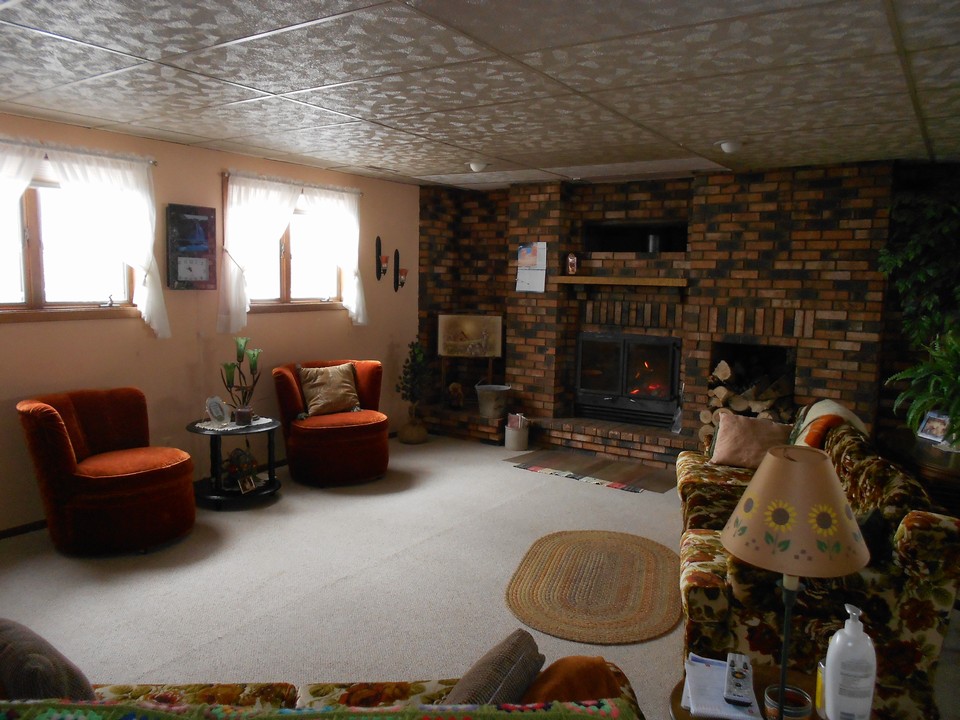 lower level with fireplace lots of large windows and natural light.  basement is only 4 feet in the ground.