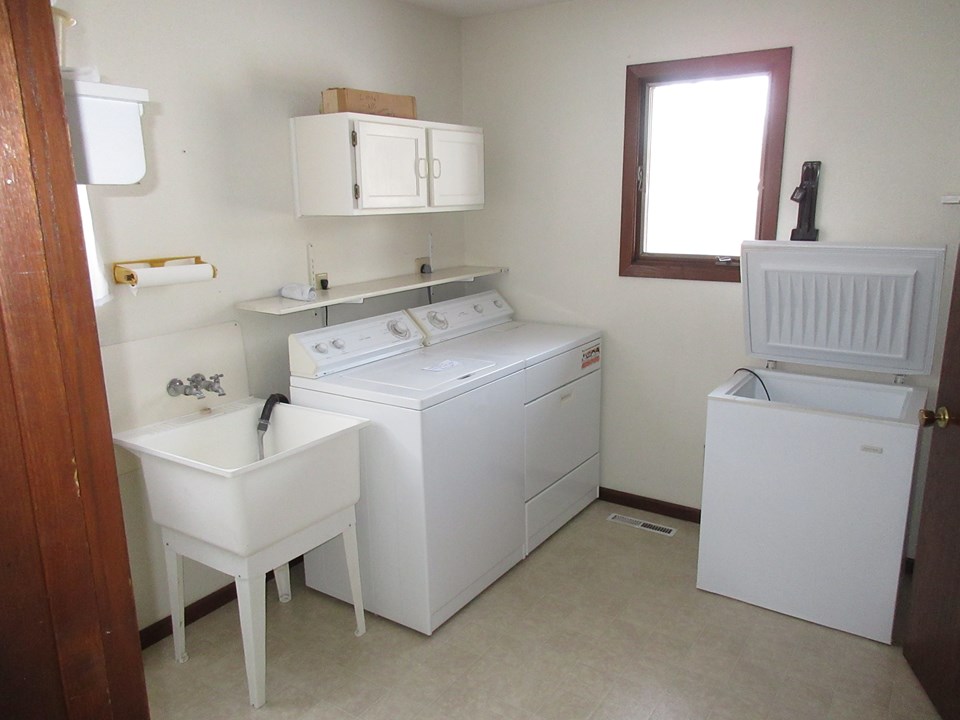 main floor laundry located between the garage and the kitchen.