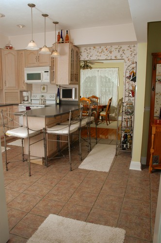 kitchen tile floor leads to the dining room