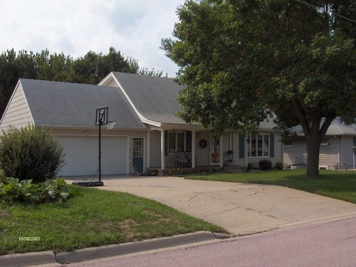 front of house. nice front lawn and porch.  pillars to set the house apart from the neighbors.