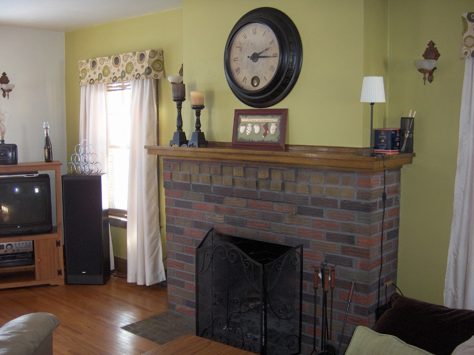 living room fireplace and hardwood floors