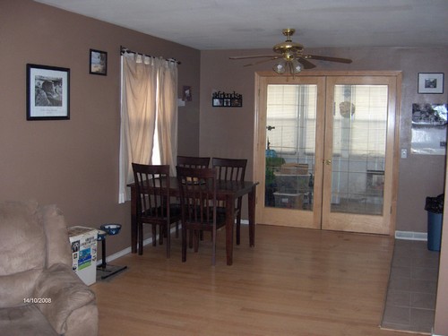 dining room open to kitchen, doors to porch