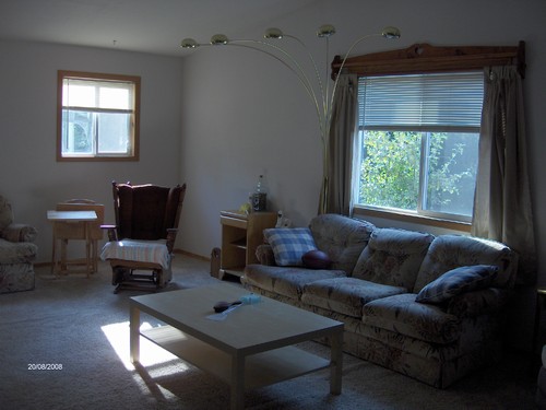 living room with large window overlooking back yard