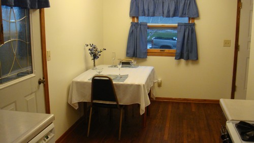 dining area original 3/4 inch hardwood floors and open to the kitchen.