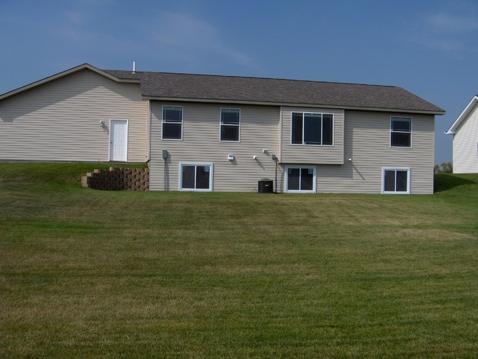 back of home lots of windows for natural light.  egress windows for basement.
