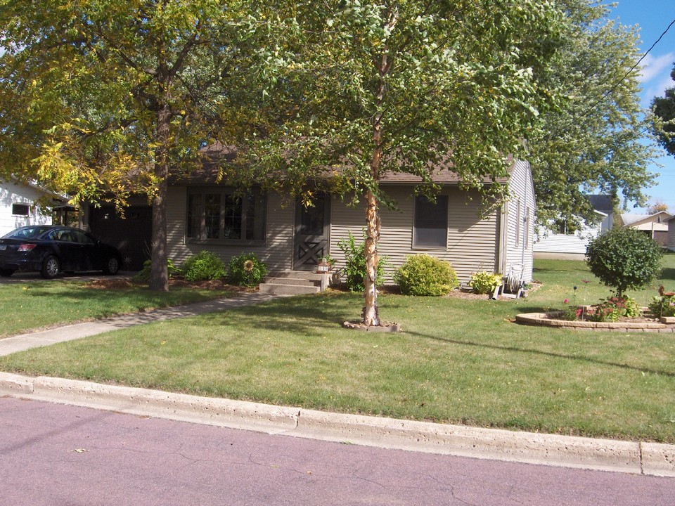 front of house located in private neighborhood, with nice yard.