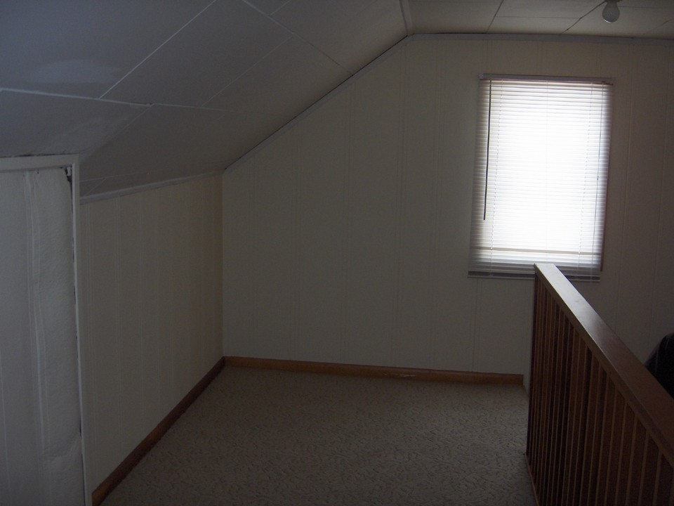 open stairway to third bedroom.