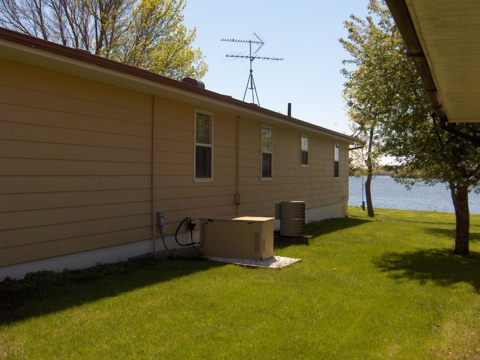 back of house notice the generator and central air.