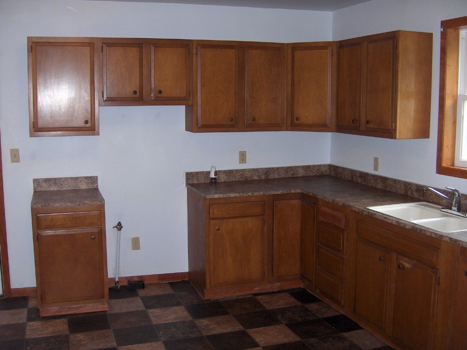 kitchen lots of cupboards and new flooring.
