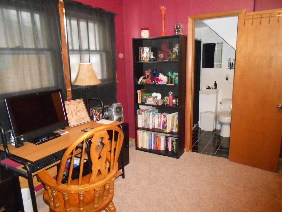 main floor bedroom or office with bathroom