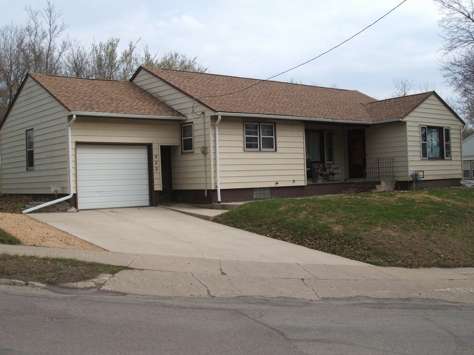 front of home new shingles in 2011, new driveway in 2006, single attached garage, covered porch.