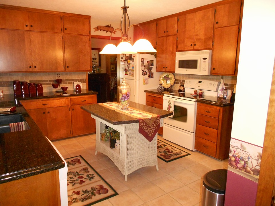 updated kitchen new countertops and backsplash.