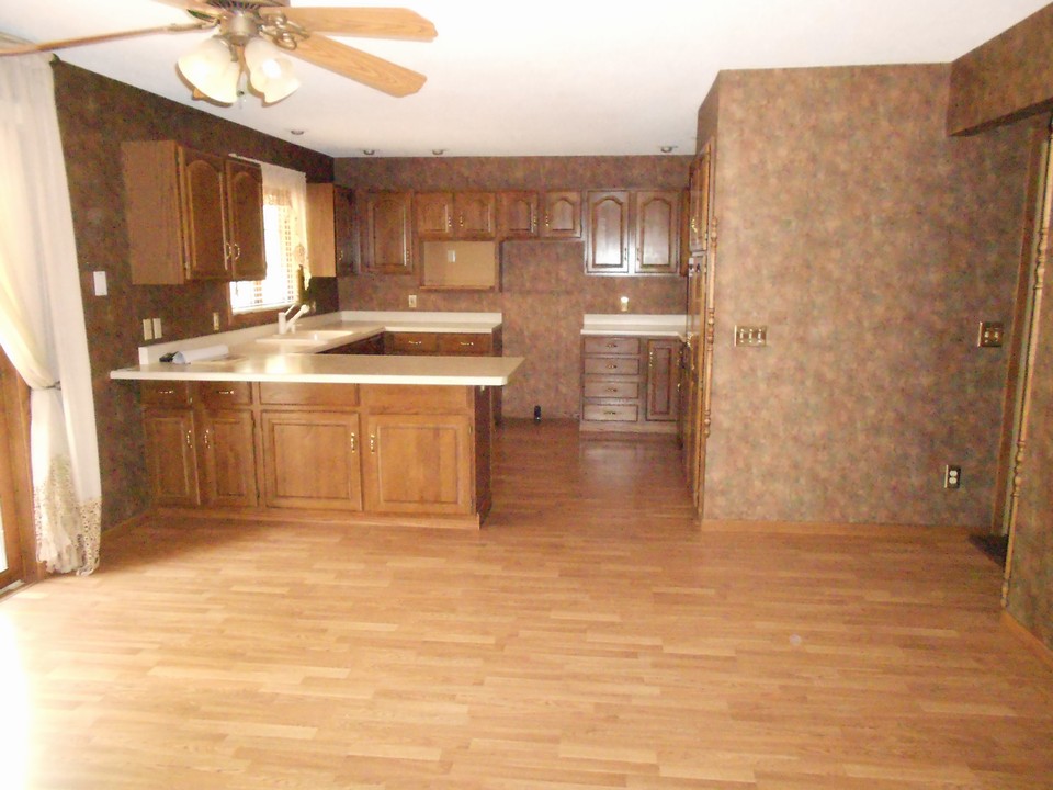 unfurnished dining room open to kitchen