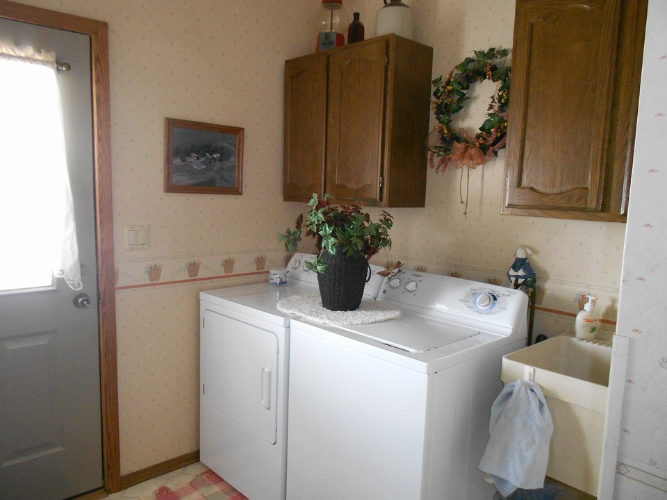 main floor laundry located just in the house from the garage.  also, notice the sink.