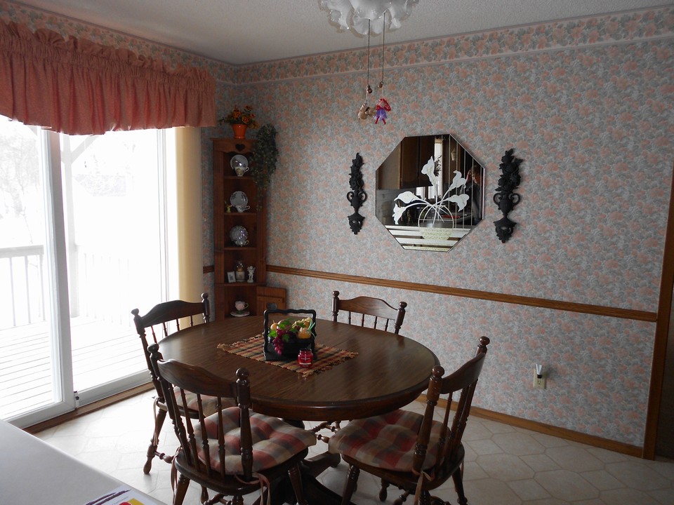 dining area open to the kitchen.  patio doors to the covered porch on the front of the house.