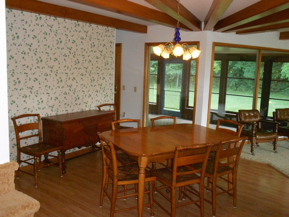 dining room 3 season porch in the background