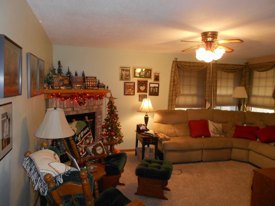 newer living room on main floor with fireplace