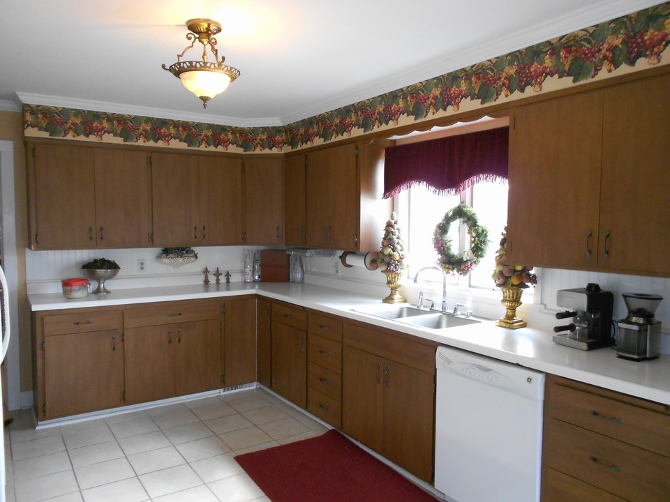 kitchen tile floor, crown molding, dishwasher, lots of cupboards