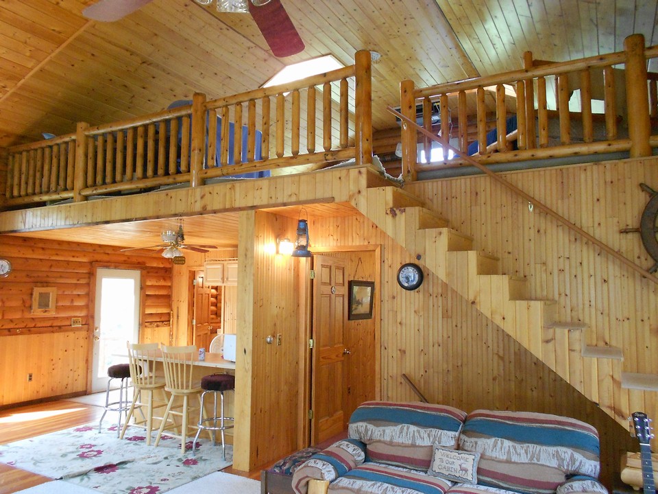 view of loft and stairs