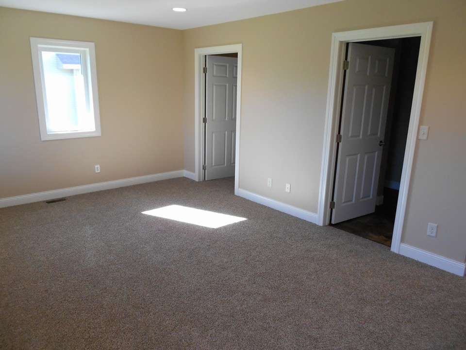 master bedroom walk in closet and bathroom