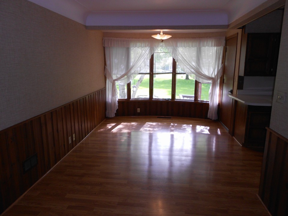 dining room windows to the backyard and door to the deck
