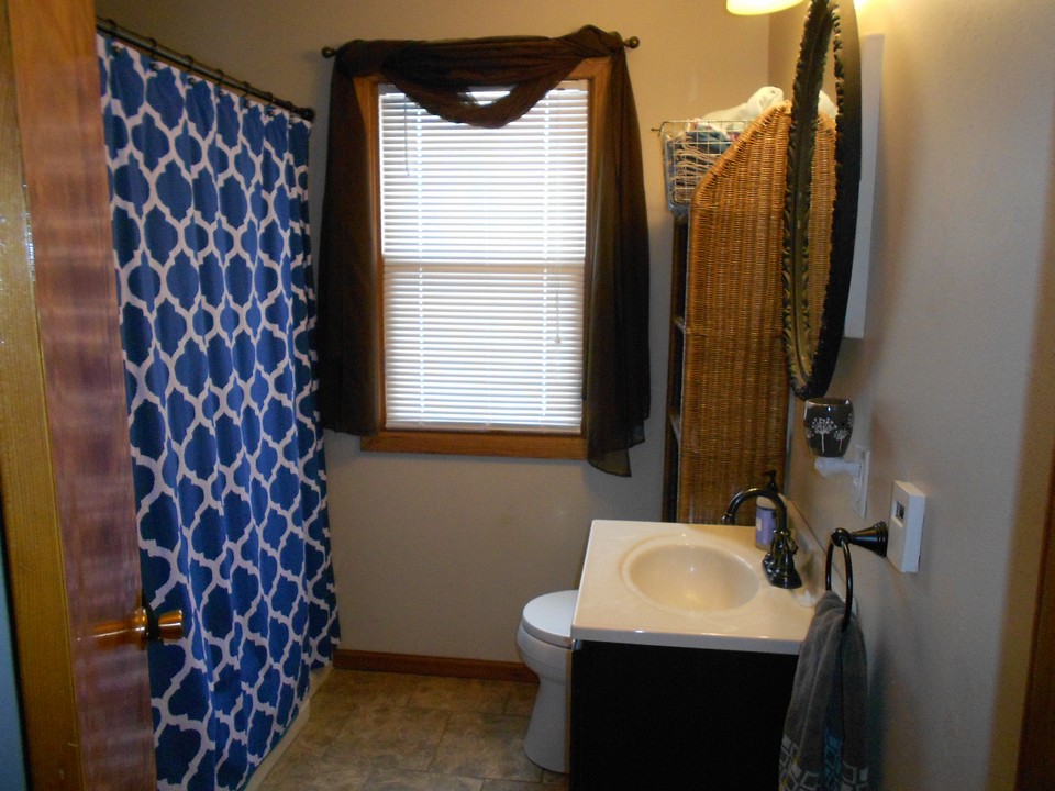 bathroom remodeled with a heated floor and tub/shower surround