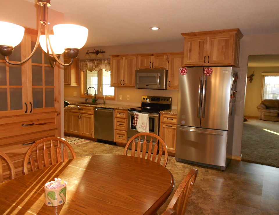 dining room, kitchen, living room built in storage, stainless appliances, cambria countertops, hickory easy close cabinets