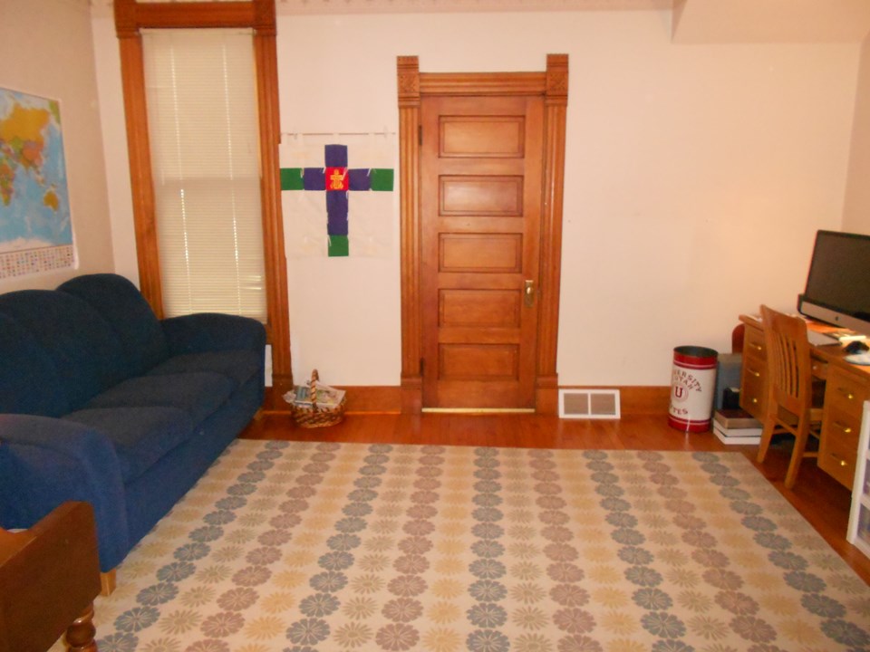 additional family room this room is open to the living room or can be separated by pocket doors.