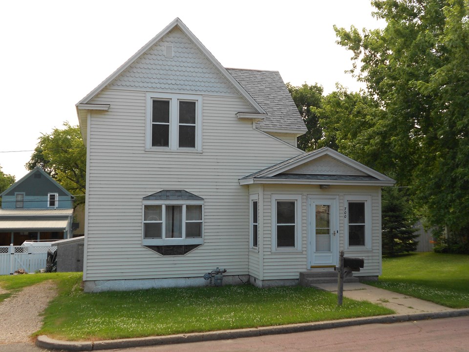 front of home just a few blocks from the schools, parks, churches, and downtown.