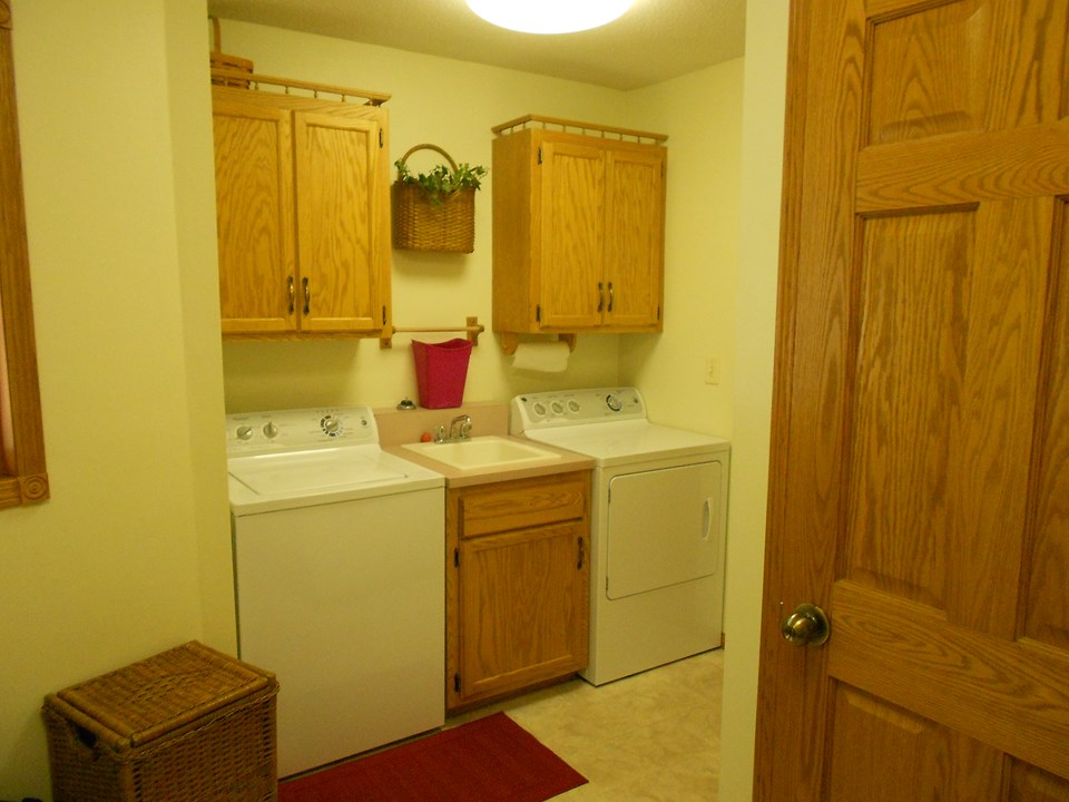 main floor laundry and half bath lots of storage.