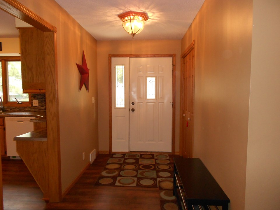 front entry new flooring, nice side lite, closet.
