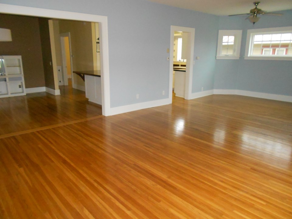 living room shows wide open to dining room and kitchen