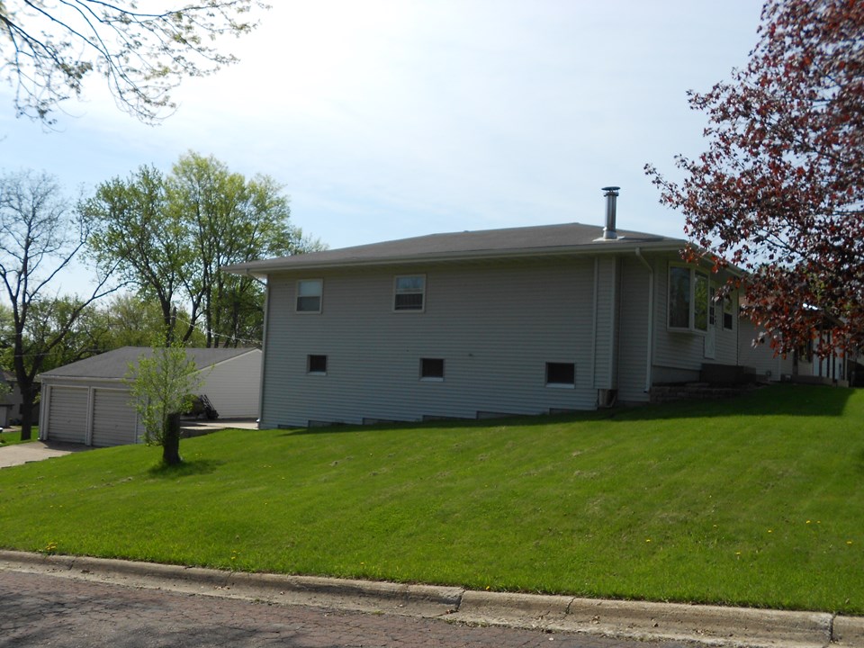 side of home walk out basement and large garage