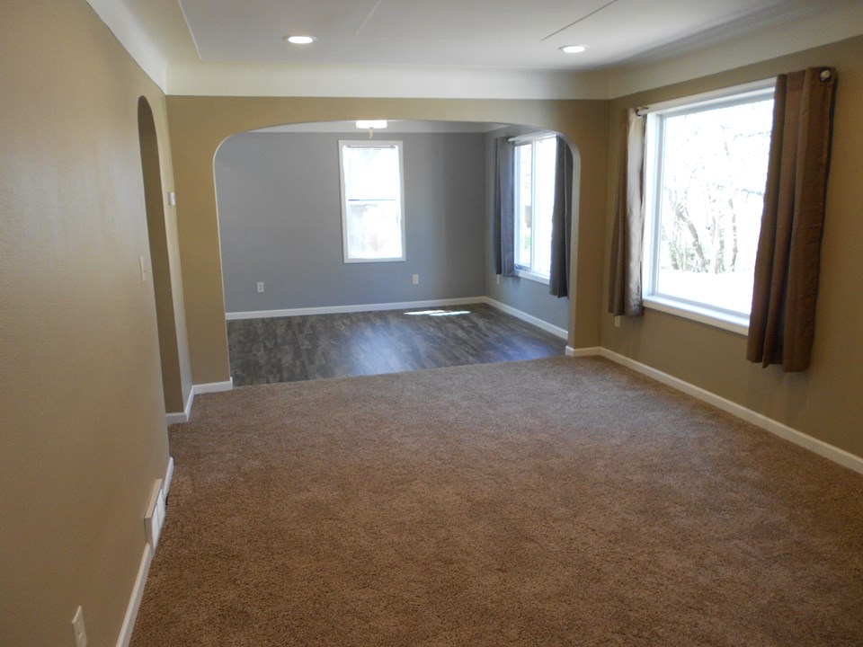 living room and dining room all new flooring, lights, outlets, switches, paint, etc.