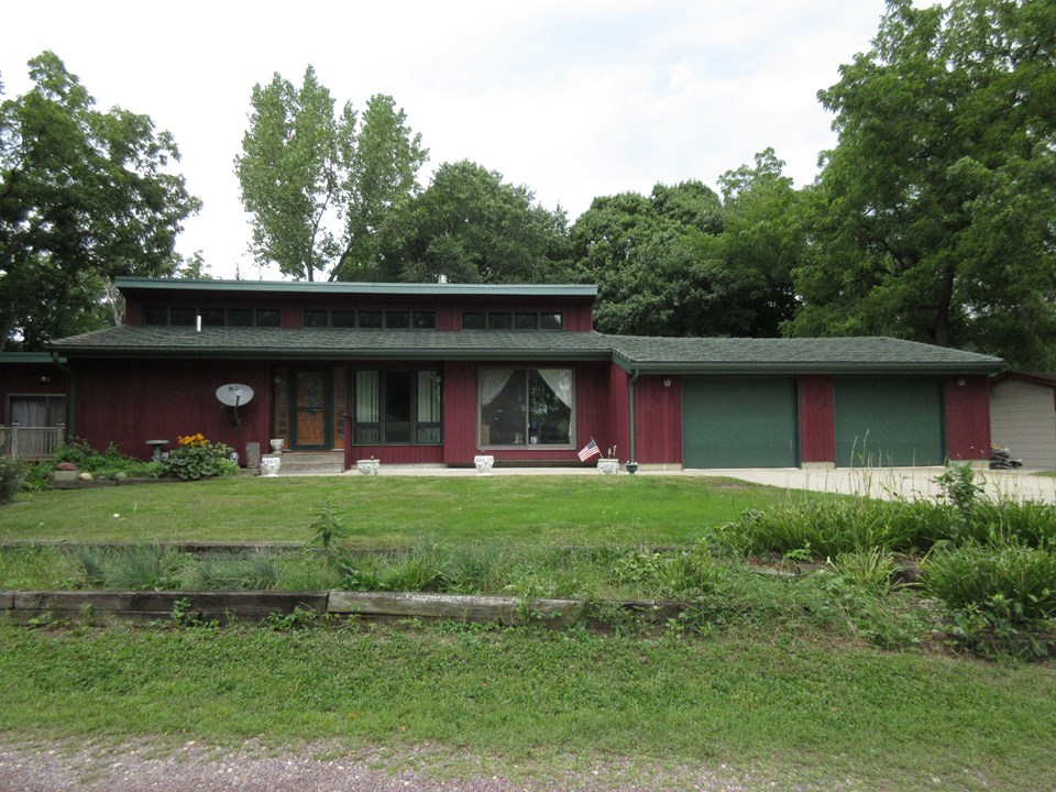 front of home newer metal shake shingles, large double garage, nice landscaping.  great curb appeal.