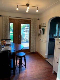 dining room walkway to kitchen and open to the living room.  new patio door to the new deck.