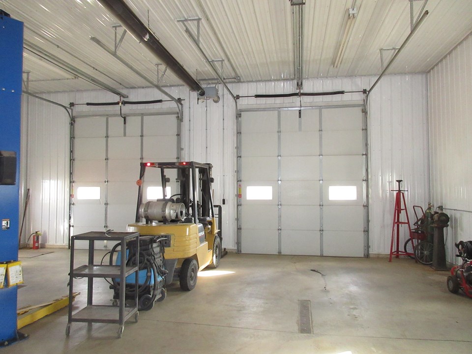 floor drains, overhead heat, dual 12 foot doors