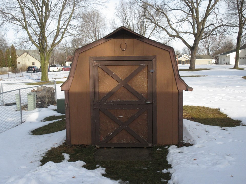 backyard garden shed with cement floor