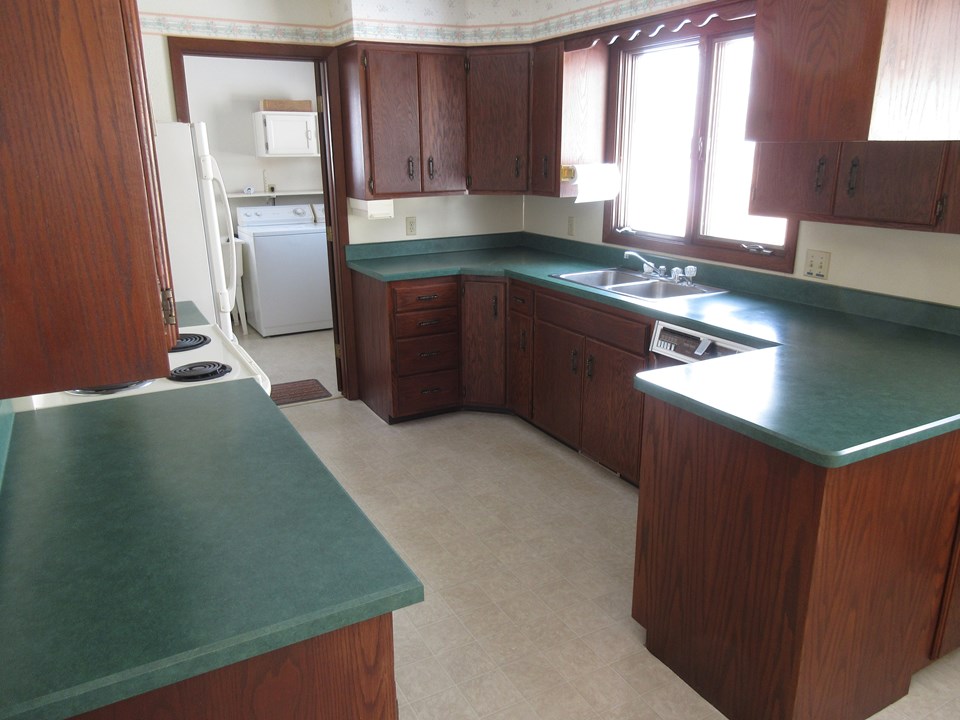 kitchen lots of cupboards, door to the laundry and mud room.