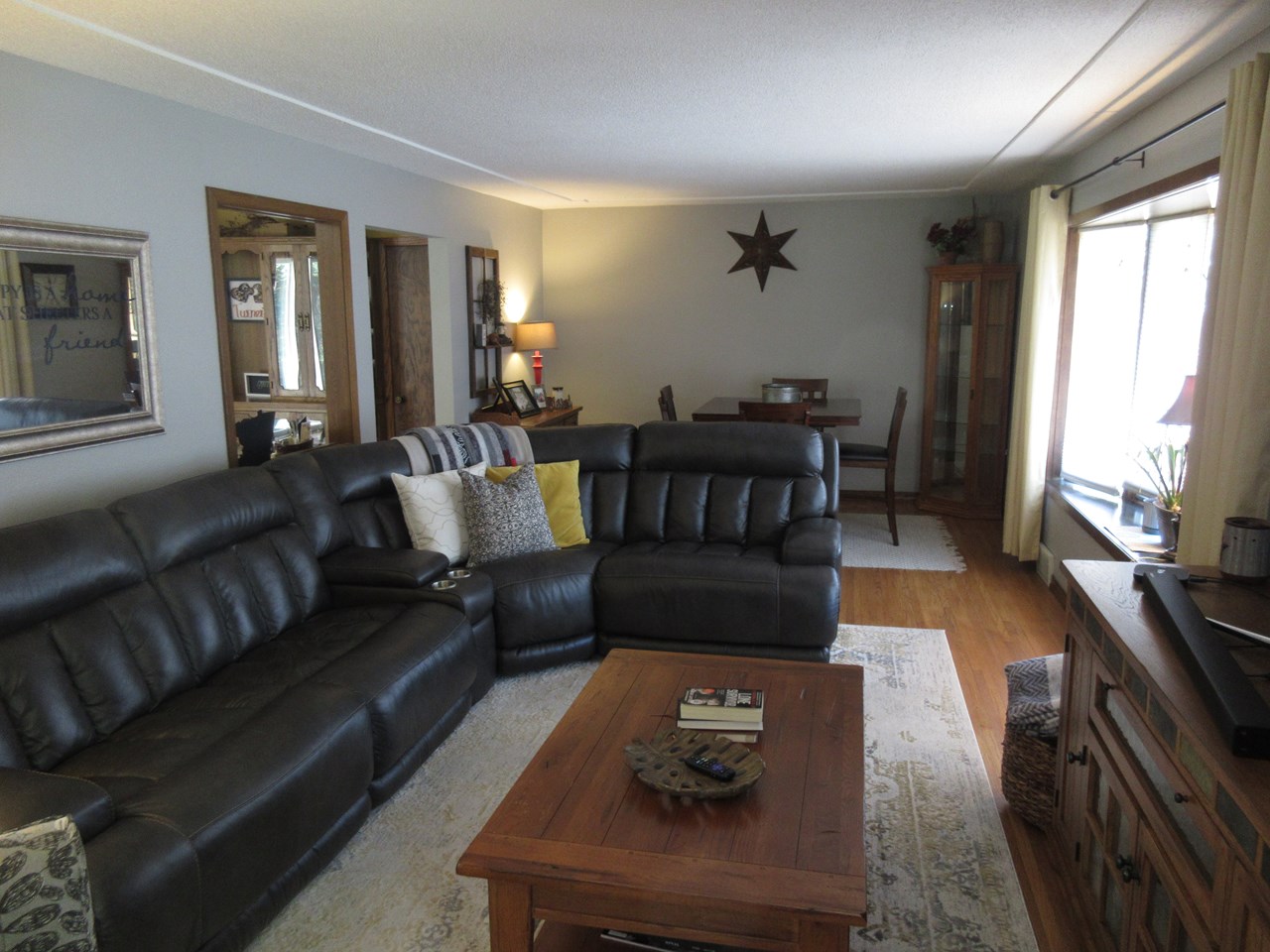 living room very nice coved ceilings.  bay window.