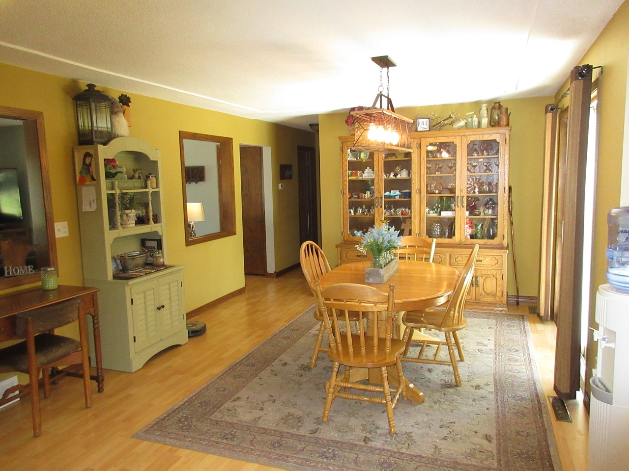 dining room 2 built in hutches.  patio door.