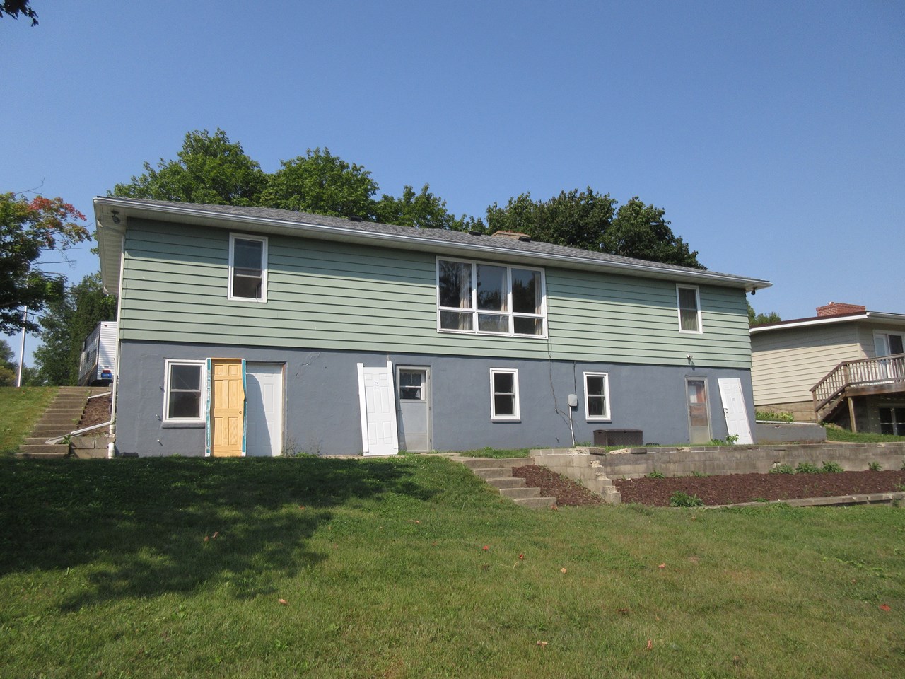 walk out basement new doors to be installed.   new landscaping.