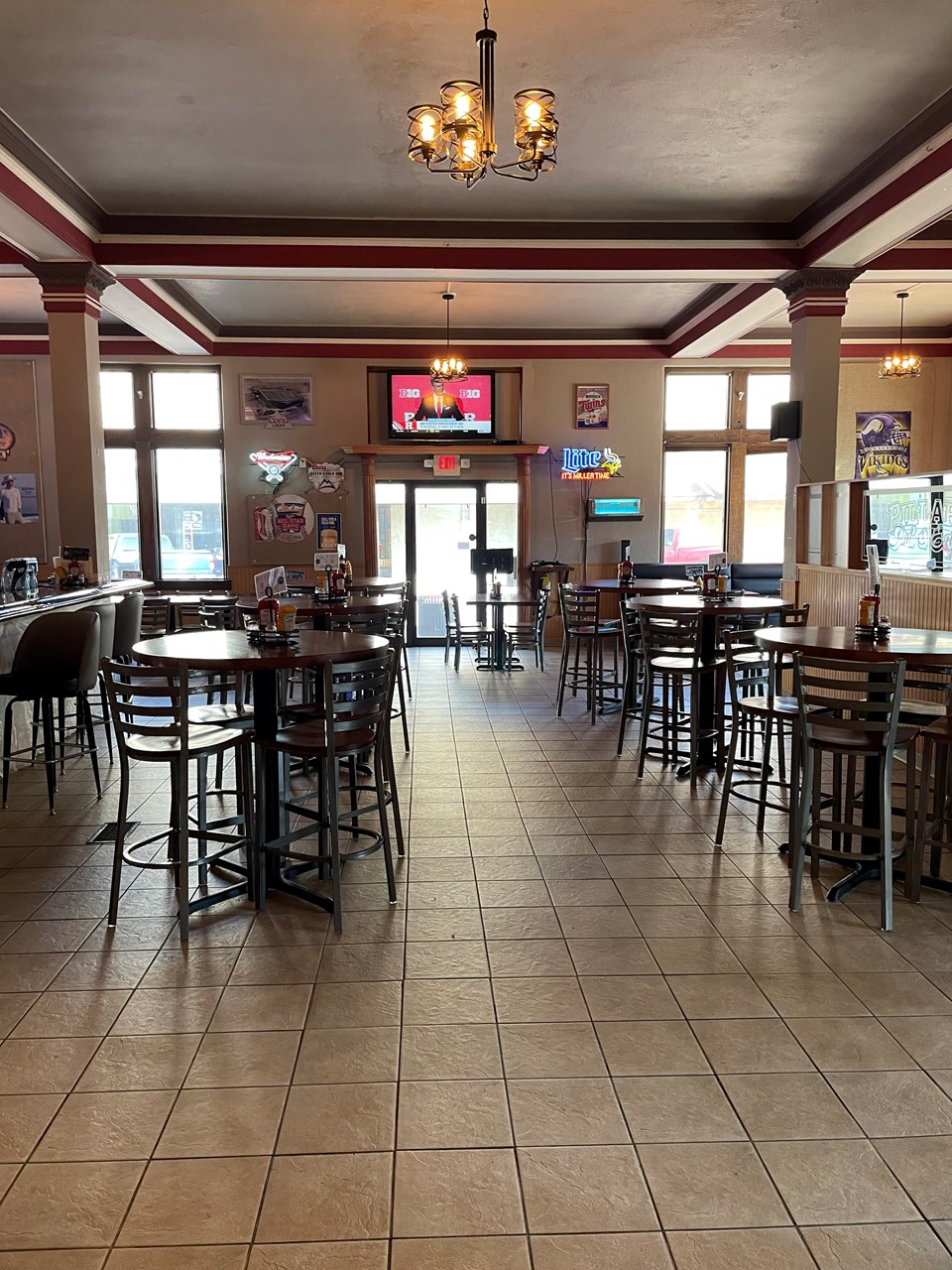 bar area with high top tables and chairs