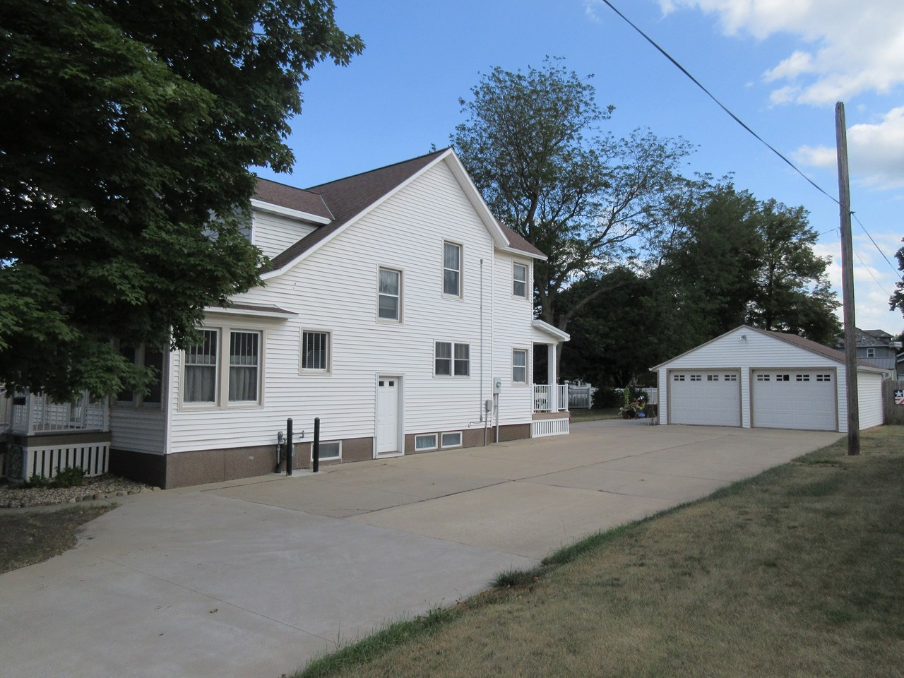 side of home nice driveway and big garage