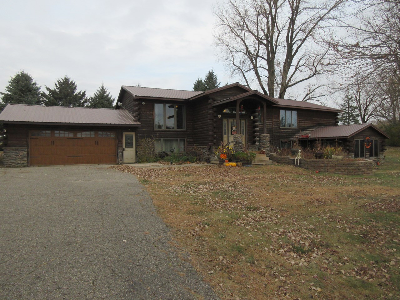 front of home attached garage....nice landscaping....good roof....nice curb appeal