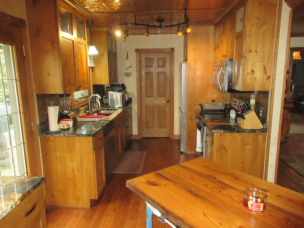 kitchen granite counters and hardwood floors.  access to the deck.