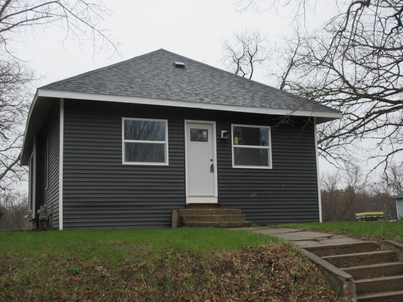front of house new shingles, new windows, new siding, new door