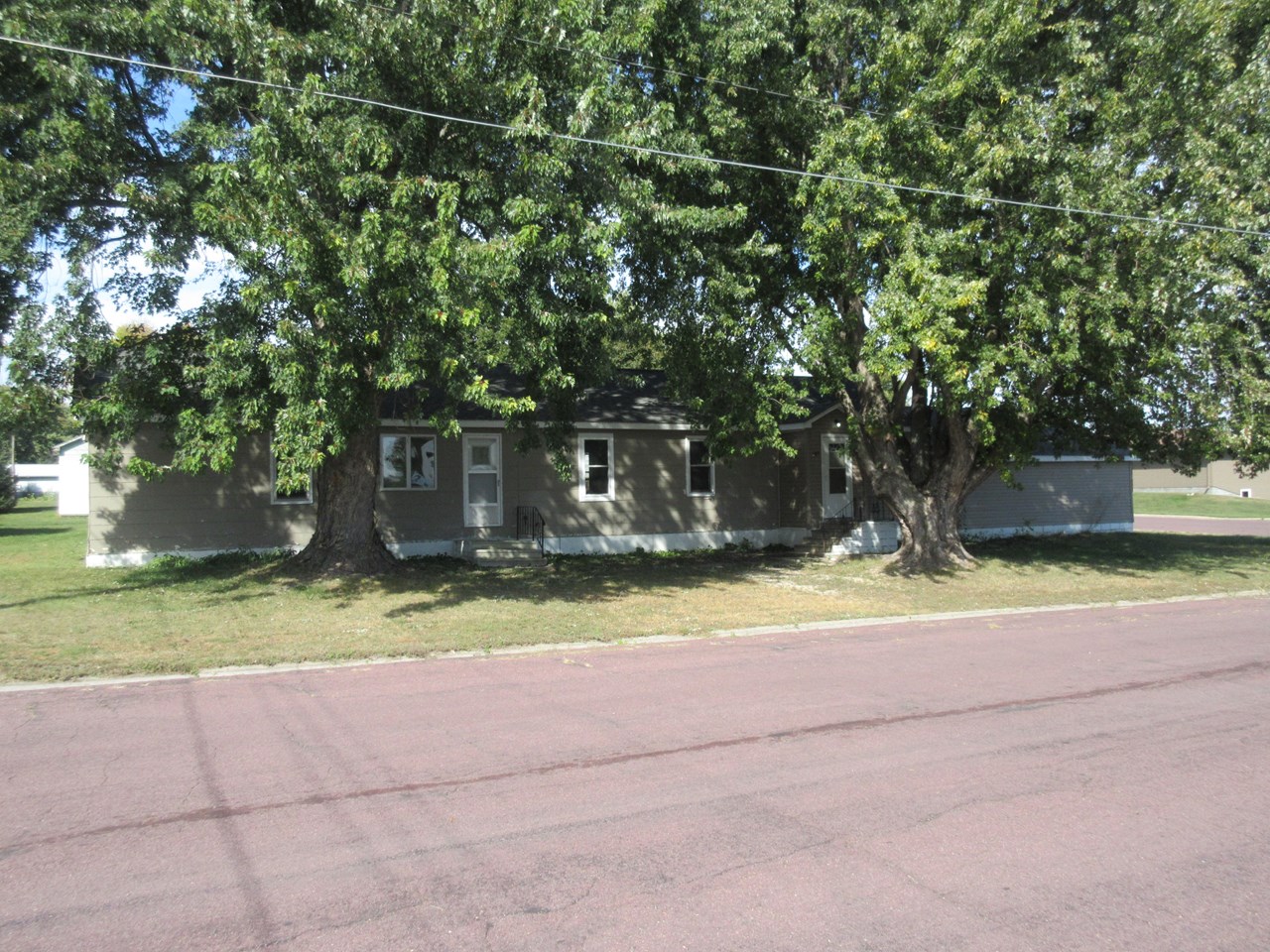 front of larger house