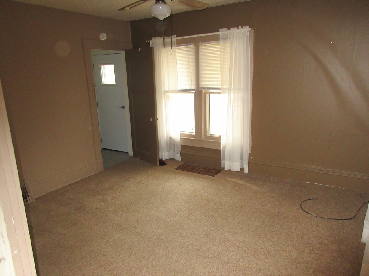 living room and door to upstairs
